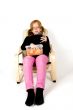 little girl is eating in her chair