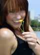 Young woman with a yellow flower.