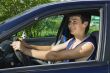 Young men driving a car
