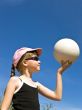 girl in sun glasses with ball