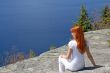 Girl sitting on a rock, enjoying the view
