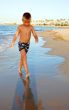 small boy on the beach of sea