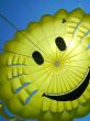 yellow fun parachute with smiling person