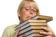 Attractive Student Struggles with Her Books