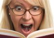 Attractive Woman Taken Back While Reading