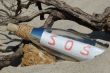 Message in a bottle with SOS signal