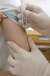 nurse hand with syringe doing injection