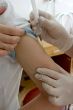 nurse hand with syringe doing injection