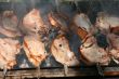 Preparing meat barbecue upon open fire