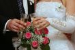 hands of newlyweds with champagne cups