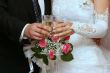 hands of newlyweds with champagne cups