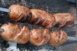 Preparing meat barbecue upon open fire