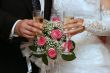hands of newlyweds with champagne cups