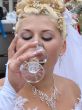 Young bride drinking champagne