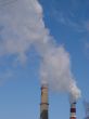 cloudscape with smoking industrial pipes
