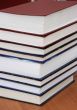  	Stack of new books with hard cover spine