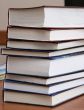  	Stack of new books with hard cover spine