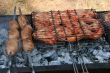 Preparing meat barbecue upon open fire