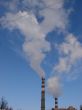 cloudscape with smoking industrial pipes