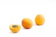 Fresh appetizing apricots on a white background