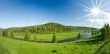 Summer landscape. Village on the river. Panorama.