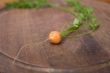 baby carrot on a chopping board