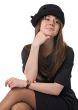 smiling young woman in black hat