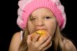 little girl eating apple