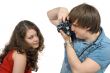 Photographer taking pictures of the young woman