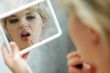 Woman with lipstick and mirror