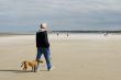 Senior man is walking his dog