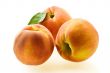 three ripe fresh peaches