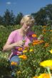elderly woman is getting flowers