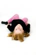 little girl is laying on floor