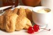 Breakfast plate with croissants and cherries