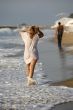 Woman and man at coastline