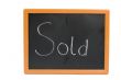 chalkboard with the text sold