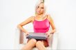 girl in pink dress with laptop