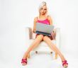 girl in pink dress with laptop