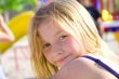 Smiling six year old girl at playground