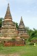 Brick stupas and green grass