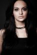 brunette girl posing on dark background