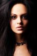 brunette girl posing on dark background