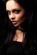 brunette girl posing on dark background