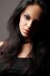 brunette girl posing on dark background