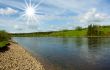Summer landscape. Clouds above the river.