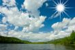 Summer landscape. Clouds above the river.