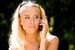 Blond woman talking on mobile phone