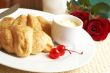 Croissant breakfast with glaze cherries