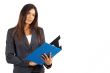 Beautiful brunette businesswoman holding clipboard
